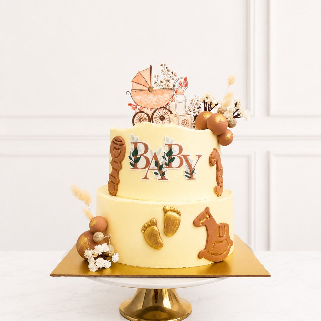 Baby shower cake with decorative elements on a white background